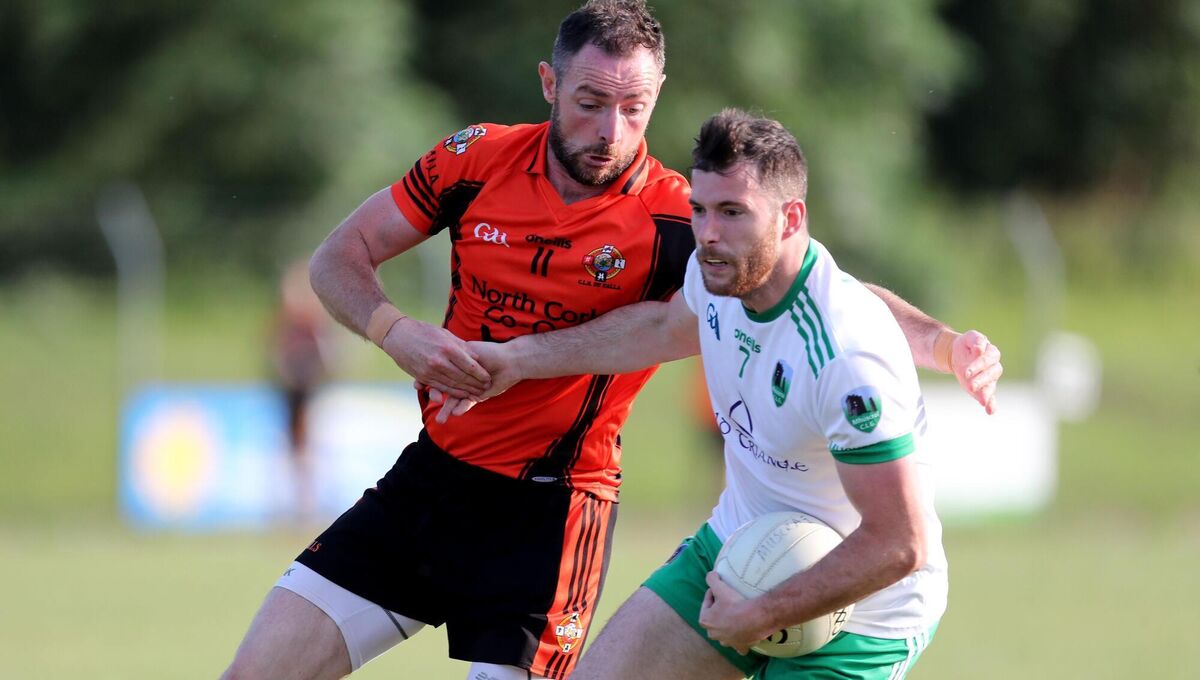 Kevin Manning, Muskerry, holds off Donncha O'Connor, Duhallow. Picture: Jim Coughlan
