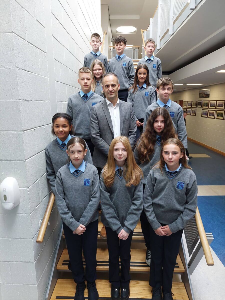On their first day at Ballincollig Community School: Leona Heinen, Sophie O’Reilly, Anna Duggan, Ciara Galvin, Mr. Desmond, Michelle Ywuong, Jac Seignott, Mykyta Balytskyi, Nicole Spillane, Doireann O’ Callaghan, Bernard O'Donovan, John Cunningham, and Cian Cremin. 