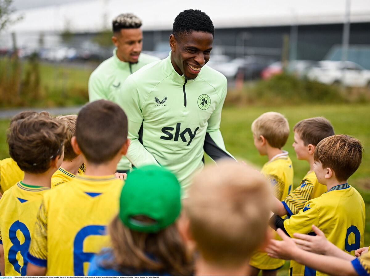Ireland's Chiedozie Ogbene is welcomed by Manortown FC players to their training session at the FAI National Training Centre in Abbotstown, Dublin. Picture:  Stephen McCarthy/Sportsfile