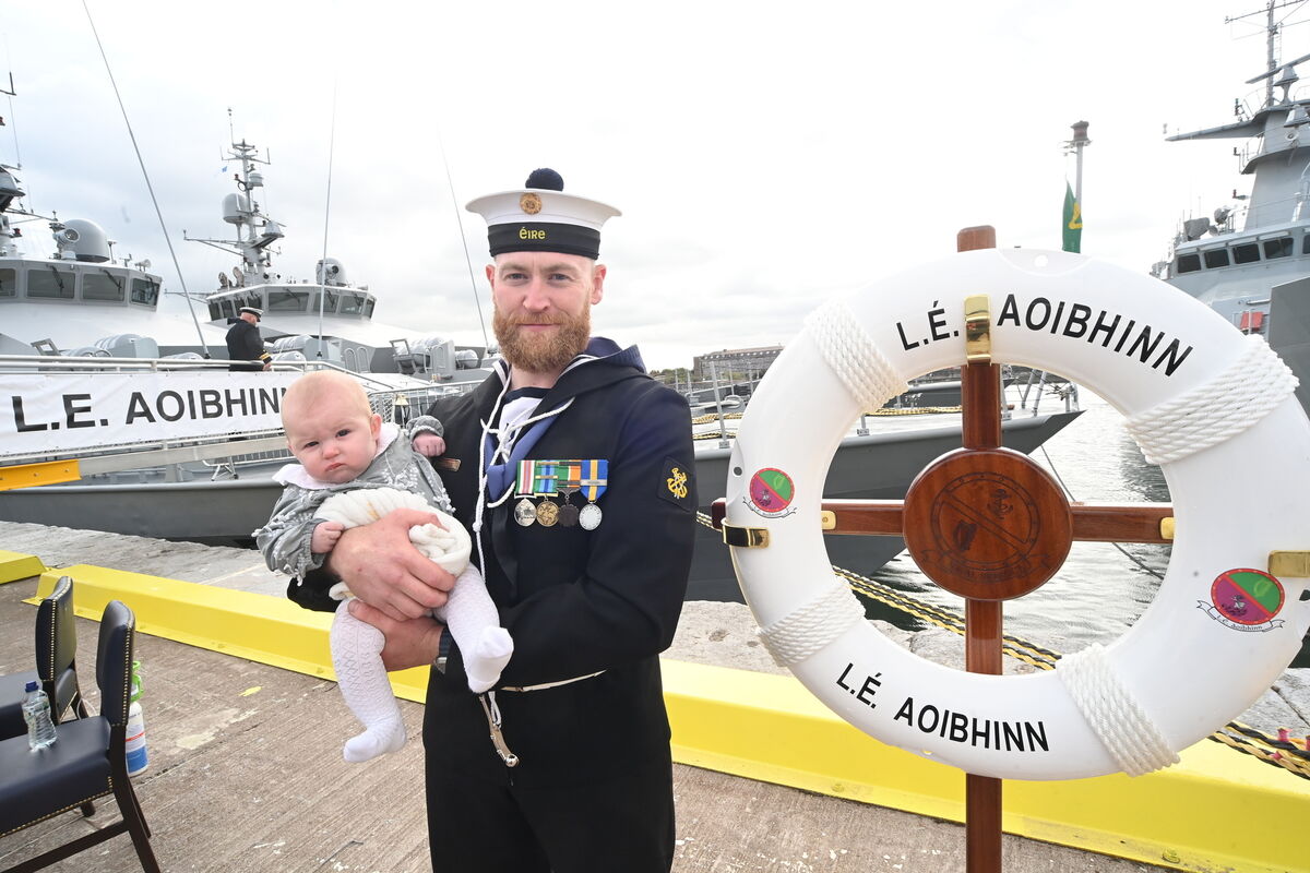 Leading Seaman Leon Dunne with his four-month old daughter Ãire beside the ship on which he will serve. Pic: Larry Cummins Leading Seaman Leon Dunne with his four-month old daughter Ãire beside the ship on which he will serve. Pic: Larry Cummins