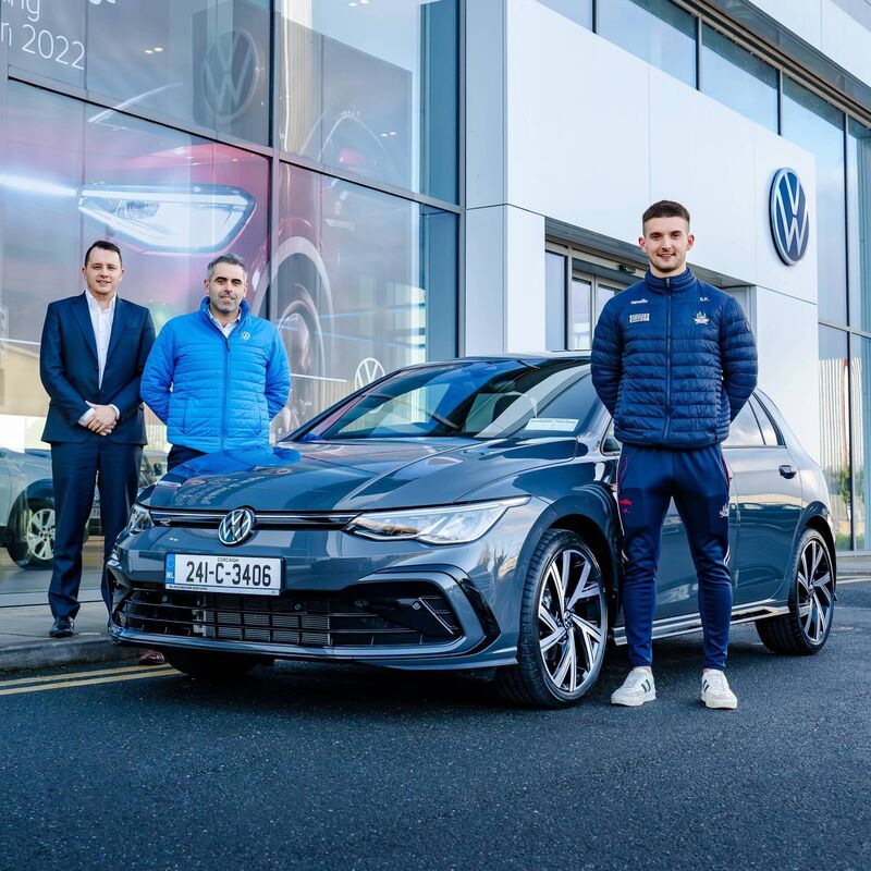 Mark Farson and David Quinlan from Blackwater Motors with brand ambassador Shane Kingston at Blackwater Motors Volkswagen, Cork city.