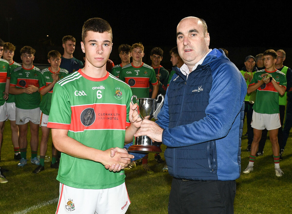 Clonakilty captain Ben Coffey receives the cup from Steven Lynch of Rebel Og, after defeating Nemo Rangers in the Rebel Og Premier 2 U16 Football League final, at The Mardyke. Picture: David Keane. Clonakilty captain Ben Coffey receives the cup from Steven Lynch of Rebel Og, after defeating Nemo Rangers in the Rebel Og Premier 2 U16 Football League final, at The Mardyke. Picture: David Keane.
