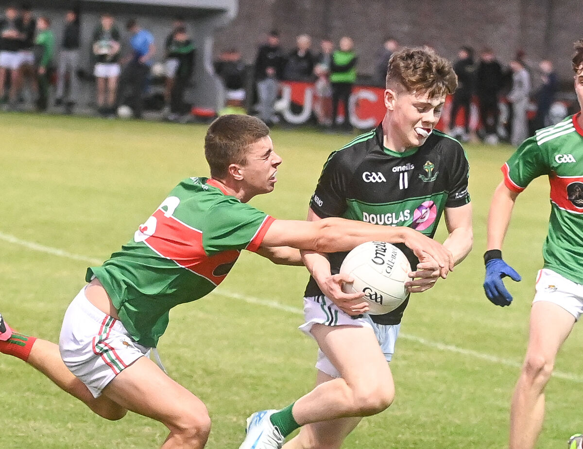 Nemo Rangers' Rory Denn is tackled by Clonakilty's Ben Coffey, during the Rebel Og Premier 2 U16 Football League final, at The Mardyke. Picture: David Keane. Nemo Rangers' Rory Denn is tackled by Clonakilty's Ben Coffey, during the Rebel Og Premier 2 U16 Football League final, at The Mardyke. Picture: David Keane.