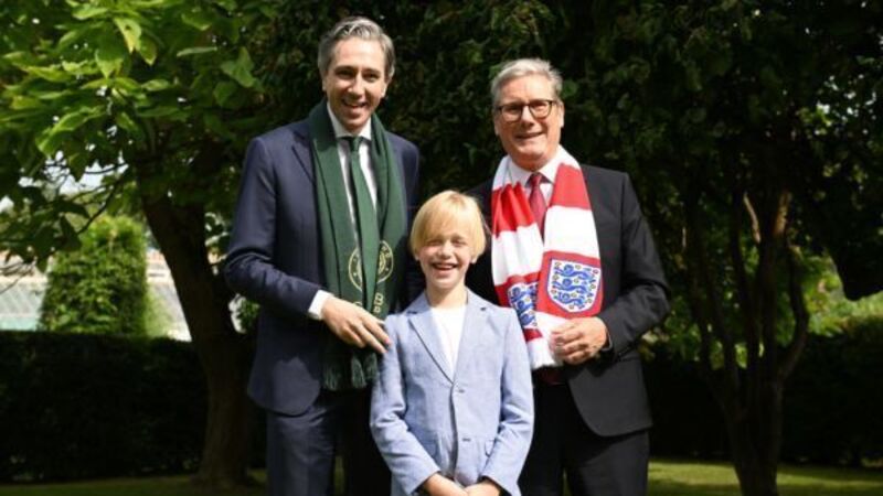 Dublin boy treated for rare illness presents Harris and Starmer with football shirts Dublin boy treated for rare illness presents Harris and Starmer with football shirts