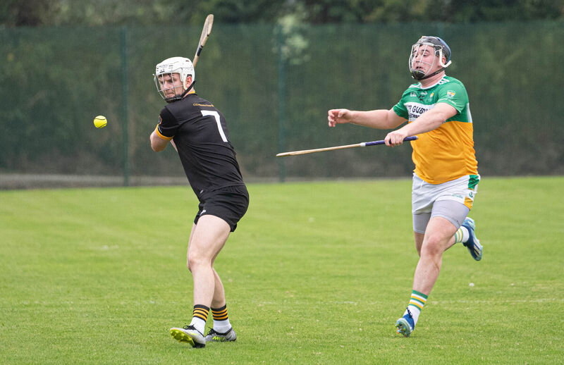 Fermoy's Padraig De Roiste clears the sliothar upfield despite the attention from Bride Rovers' Adam Walsh during the Co Op Superstores Senior A Hurling Championship match in Ballynoe. Picture: Howard Crowdy