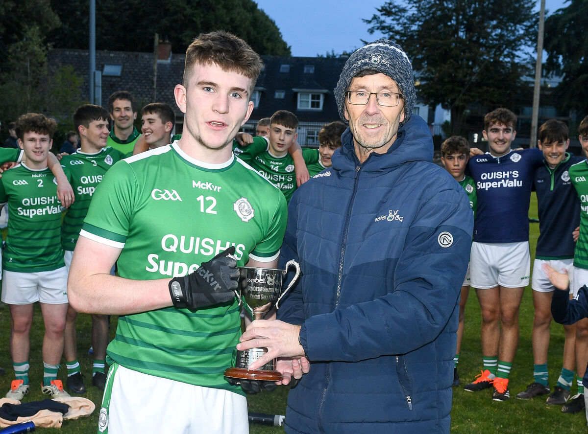 Ballincollig captain Michael Downey receives the cup from Rory Noonan of Rebel Óg. Picture: David Keane.  Ballincollig captain Michael Downey receives the cup from Rory Noonan of Rebel Óg. Picture: David Keane.