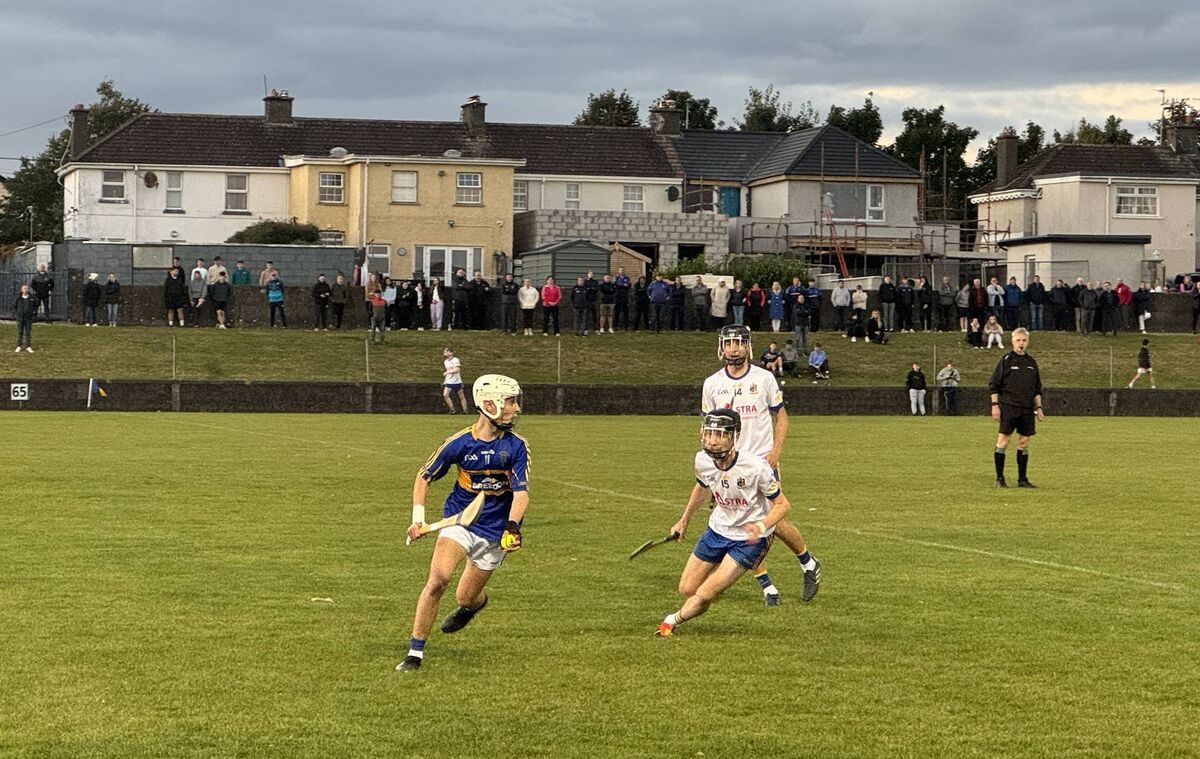 Carrigtwohill's Tom Walsh looks for a teammate as Carrigaline's Cillian Murphy applies pressure. Carrigtwohill's Tom Walsh looks for a teammate as Carrigaline's Cillian Murphy applies pressure.