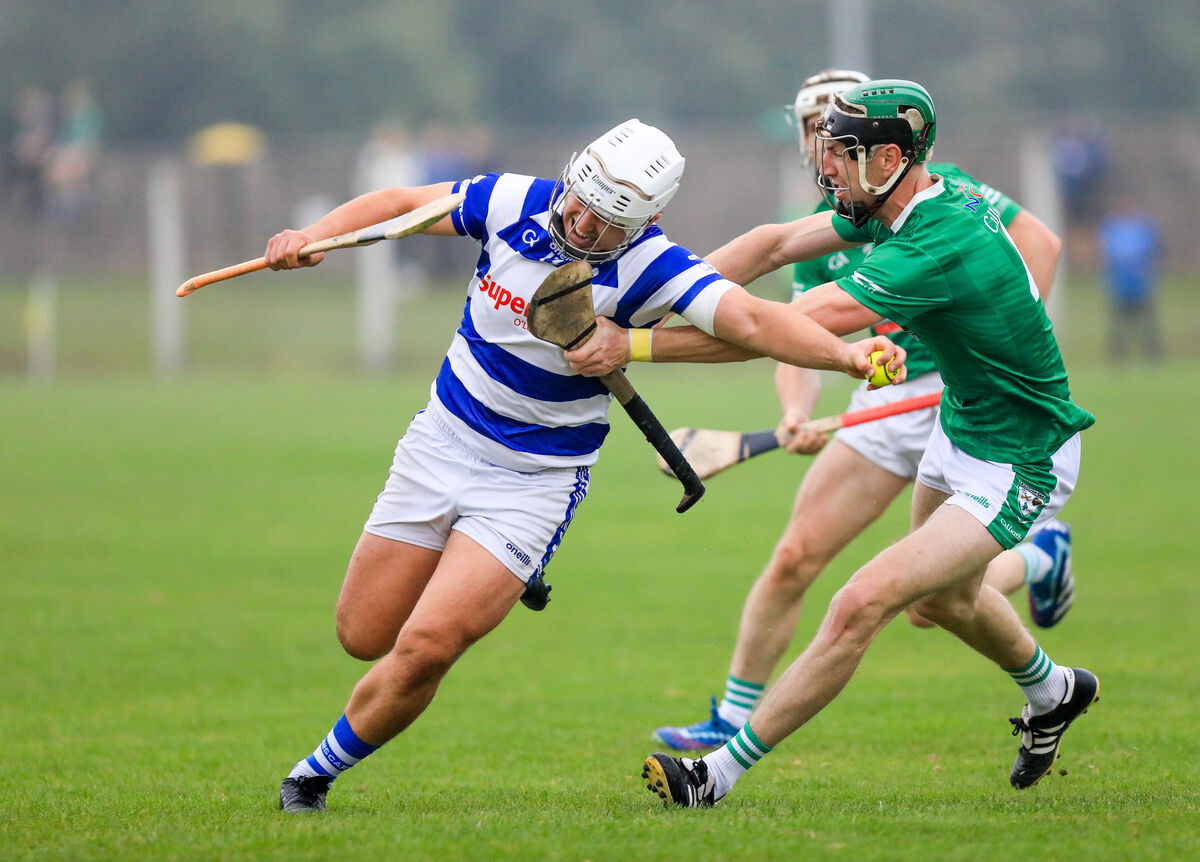 Inniscarra's Fergal O'Leary tries to burst past Killeagh's Dinny Walsh during the Co-Op Superstores SAHC game at Cobh. Picture: David Creedon