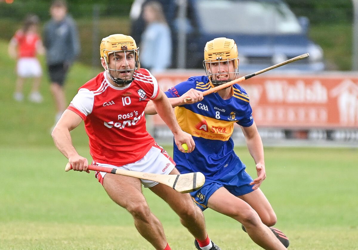  Watergrasshill's Anthony Cronin keeps possession as Carrigaline's Ronan Kelleher closes in, during their Premier IHC clash at Ballincollig. Picture: David Keane.