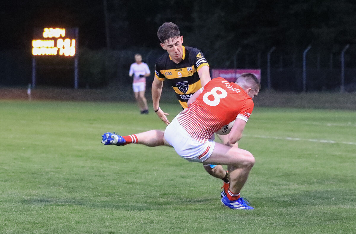 Urhan's Alan O'Sullivan and Buttevant's Aaron Trimm clash for the ball. Picture: David Creedon