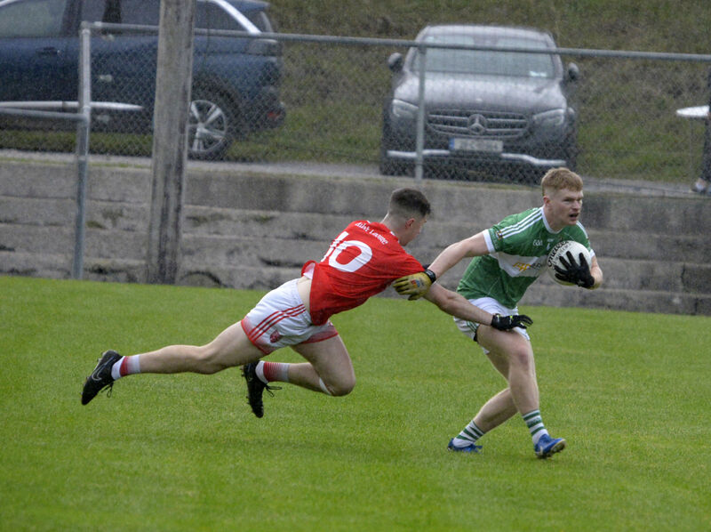 Aghabullogue's Paul Ring moves away from Aaron O'Donovan of Iveleary. Picture: Denis Boyle Aghabullogue's Paul Ring moves away from Aaron O'Donovan of Iveleary. Picture: Denis Boyle