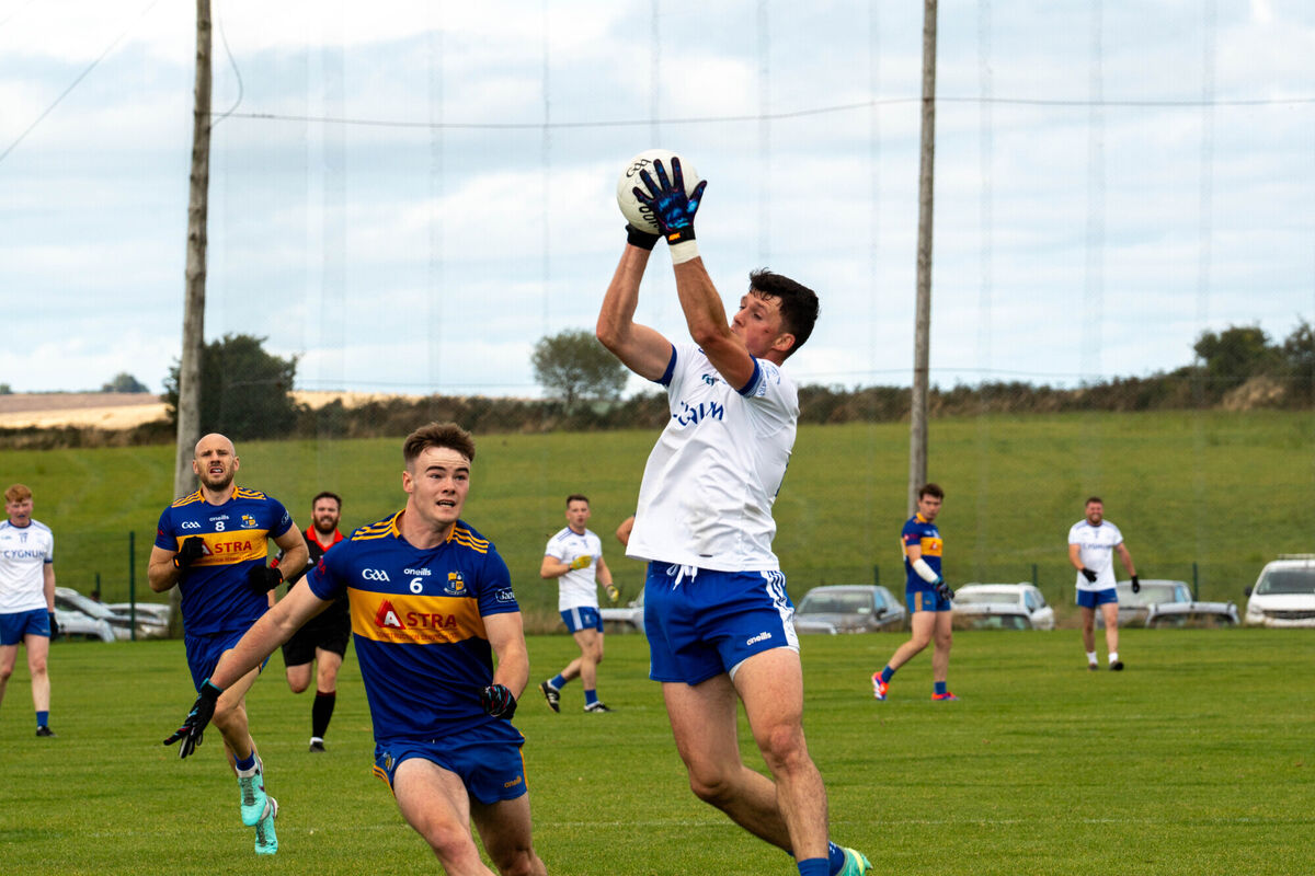 Cill Na Martra's Daniel O Dúinnin catches the ball as Chris O'Herlihy, Carrigaline looks to challenge. Picture: Noel Sweeney