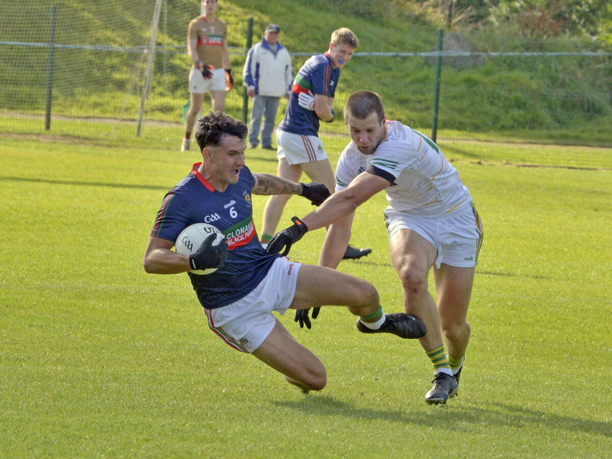  Thomas Clancy of Clonakilty holds possession despite the attentions of Tadgh Deasy. Picture: Denis Boyle