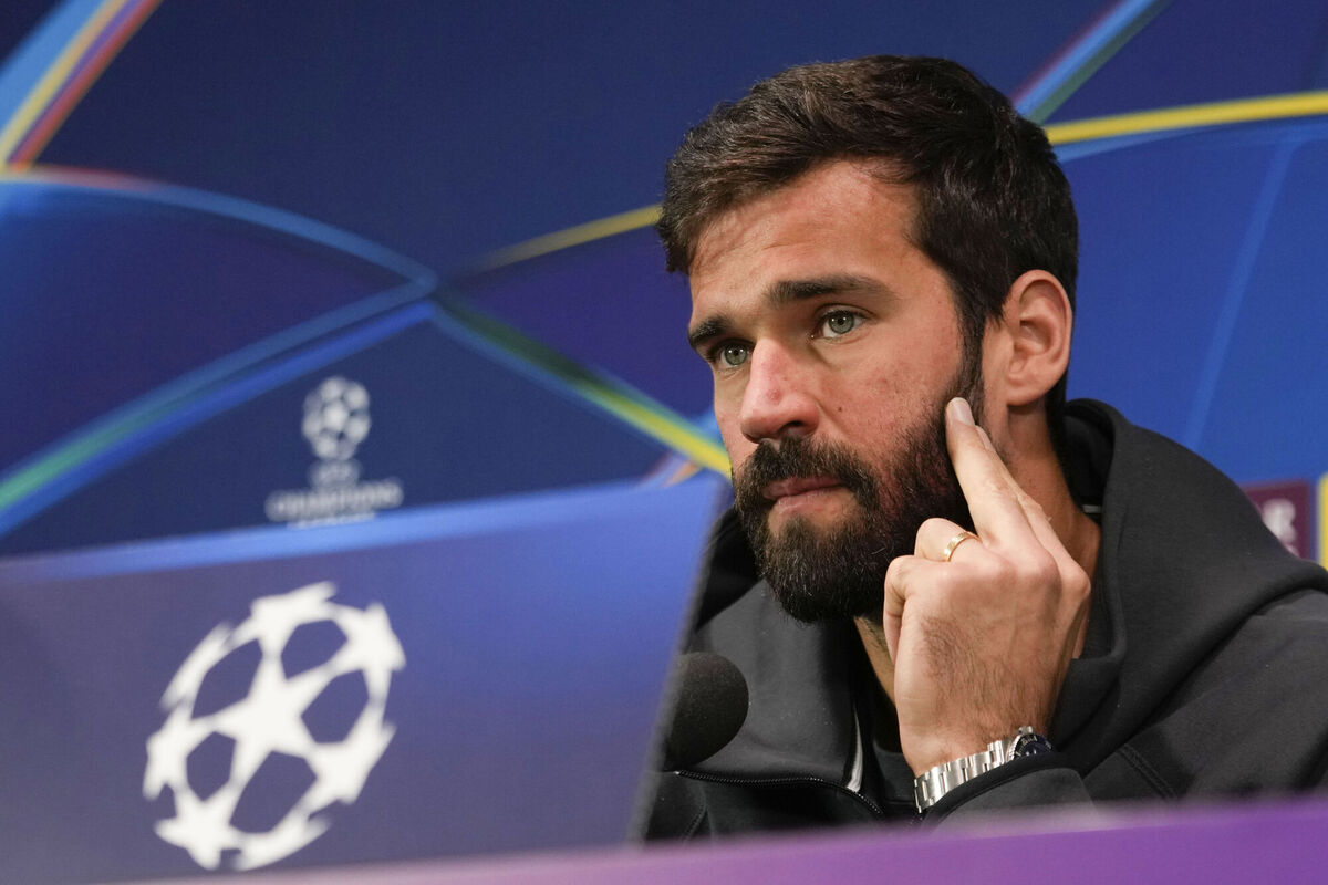 Liverpool's goalkeeper Alisson Becker speaks about player burnout during a news conference at the San Siro Stadium, in Milan, ahead of their Champions League match against AC Milan on Tuesday Picture: AP Photo/Luca Bruno