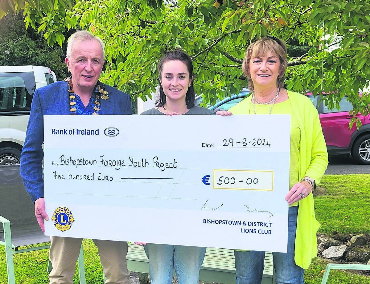 Bishopstown Lions Club president Jim Costello and treasurer Denise McCarthy present a cheque for €500 to Rachel Bradbury (centre) of Foróige.
