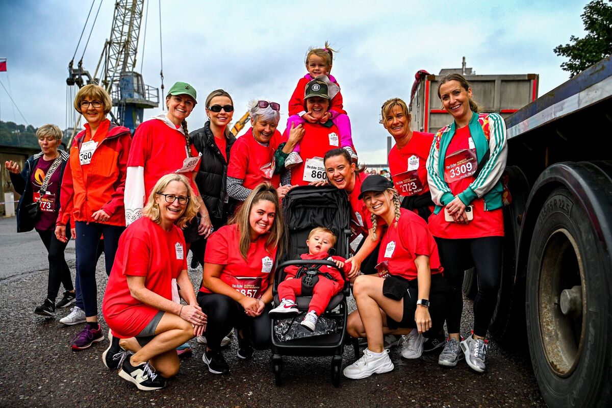 Sinead Crowley with Freya O'Riordan on her shoulders and her brother Robbie O’Riordan in his buggy after they participated behalf of Down Syndrome Ireland, with friends and family members. Picture: Chani Anderson