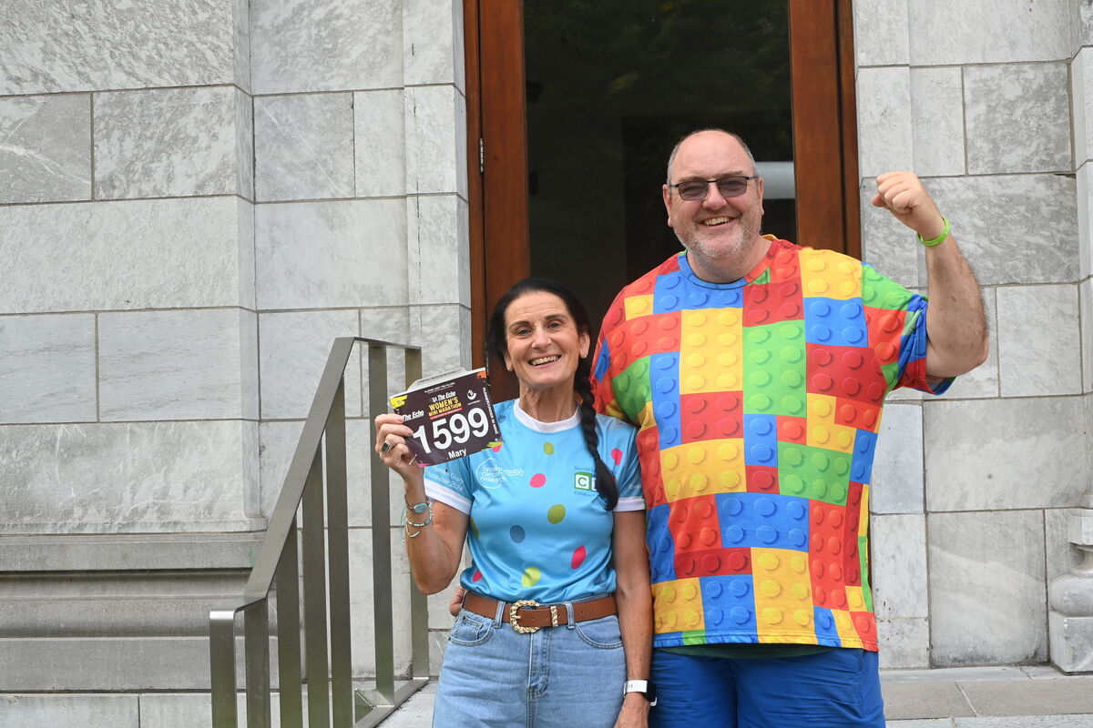 Mary Sweeney of St Finbarrs will be completing her 40th Mini Marathon race, pictured with race volunteer Graham Meikle. Collecting her race numbers for the 43rd Echo Mini Marathon. Pic Larry Cummins