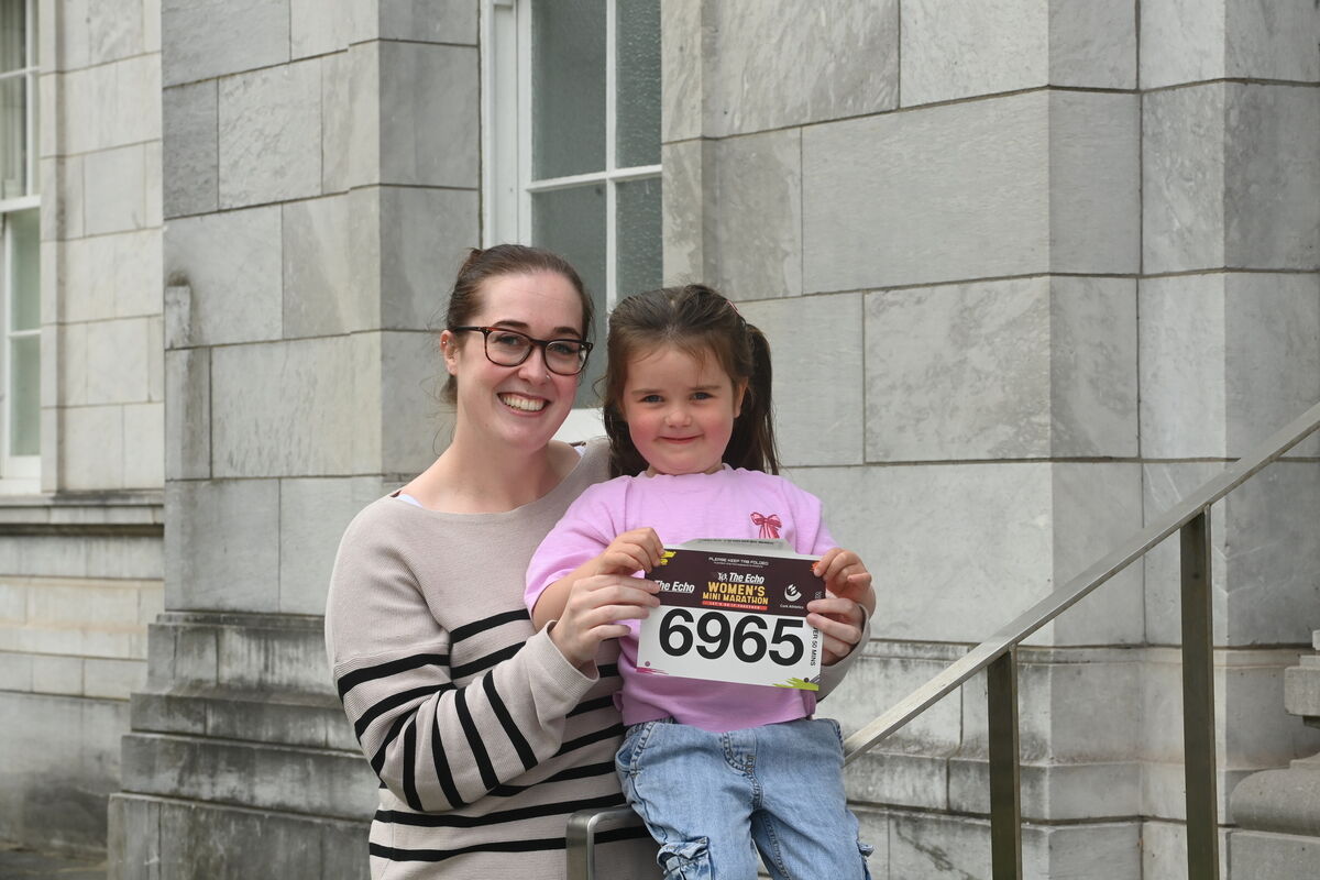Sinead Kelly who will run with colleagues from Abbeyville Veterinary Clinic in aid of Marymount Hospice, with her niece Liadh Murphy. Collecting their race numbers for The Echo Mini Marathon. Pic Larry Cummins