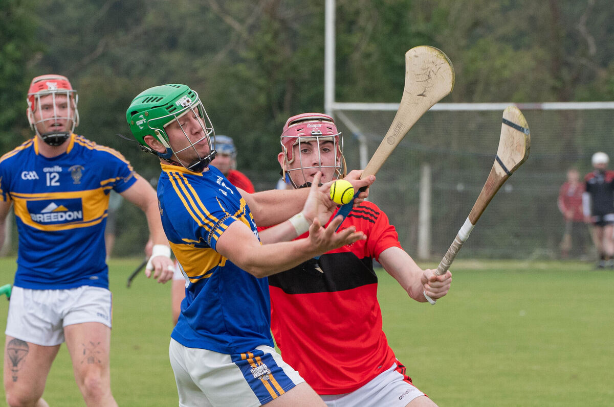 Carrigtwohill's Aaron Walsh Barry attempts to hold onto the sliotar despite the attention from Cloyne's Conor Cahill. Picture: Howard Crowdy Carrigtwohill's Aaron Walsh Barry attempts to hold onto the sliotar despite the attention from Cloyne's Conor Cahill. Picture: Howard Crowdy