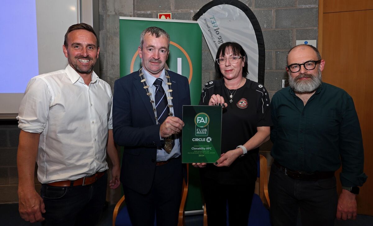 John Buckley, Chairperson Munster Football Association presents Lyndsey Cooke, Sam Doherty and Neal Doran, Clonakilty AFC with their award. John Buckley, Chairperson Munster Football Association presents Lyndsey Cooke, Sam Doherty and Neal Doran, Clonakilty AFC with their award.