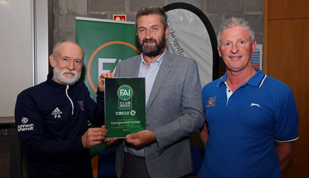 John Finnegan, Vice President FAI presents Fred Adam and Barry McGrath, Carrigtwohill United with their award. Picture: Jim Coughlan. John Finnegan, Vice President FAI presents Fred Adam and Barry McGrath, Carrigtwohill United with their award. Picture: Jim Coughlan.