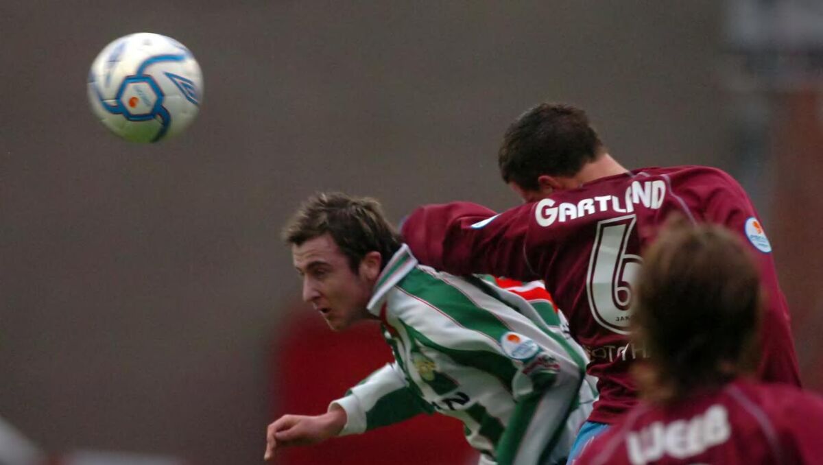 Cork City's Roy O'Donovan tussles with Drogheda United's Graham Gartland during the Setanta cup final against Drogheda at Tolka Park.