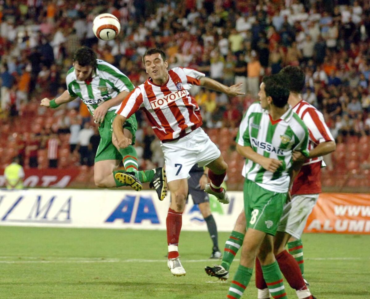 City in Europe 2006....Cork City 's Roy O'Donovan wins the ball from Red Star Belgrades Nenad Milijas during the Champions league .