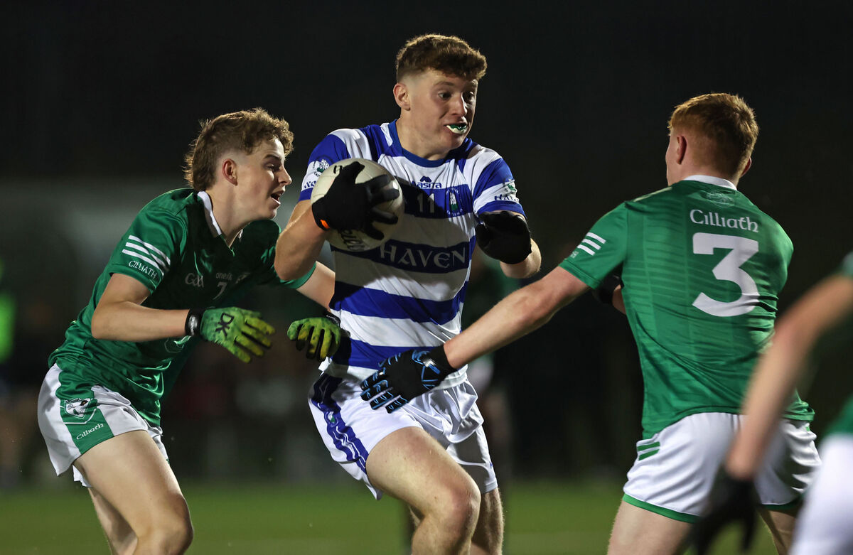 Cillian French, Castlehaven, breaks past Andrew Brenner and Harry Connon, Killeagh. Picture: Jim Coughlan.