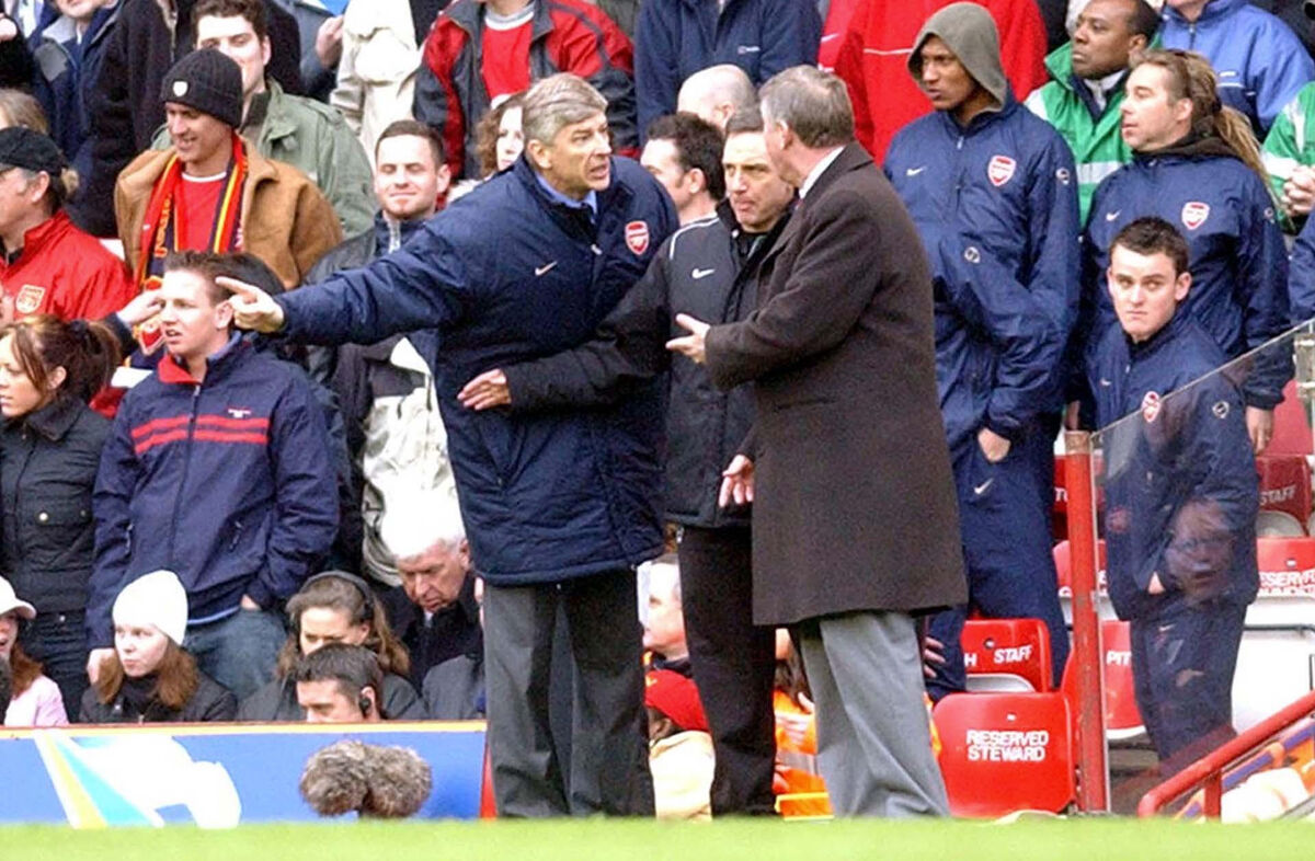 Arsenal manager Arsene Wenger (left) and Manchester United manager  Alex Ferguson (right) exchange words during the Premiership match at Highbury, London, Sunday, March 28, 2004. Picture: PA Photo: Sean Dempsey