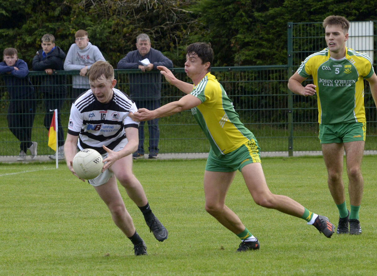 Gavin Marshall for St Nicholas' is challenged by Peter Whelton, St James'. Picture Denis Boyle