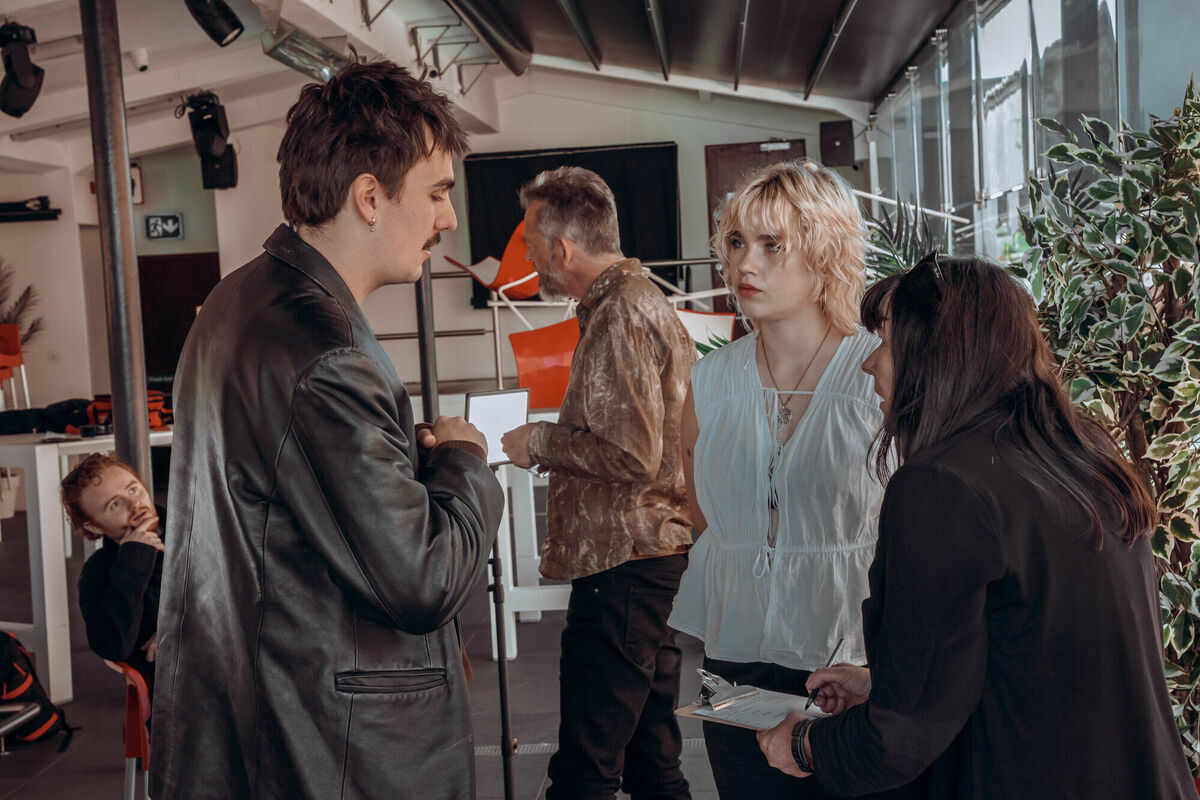 Members of Cliffords confer with producer Lesley Kane during interviews at Wavelength.