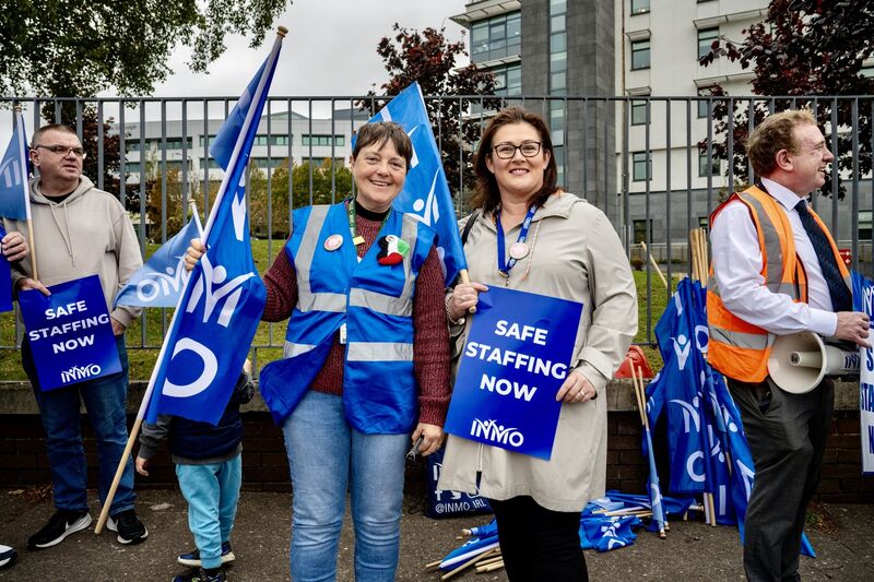 INMO members Lynda Moore and Ester Fitzgerald pictured outside CUH where there were among a large number of people who staged a protest on staffing shortages and the impact of the recruitment freeze. Picture: Chani Anderson