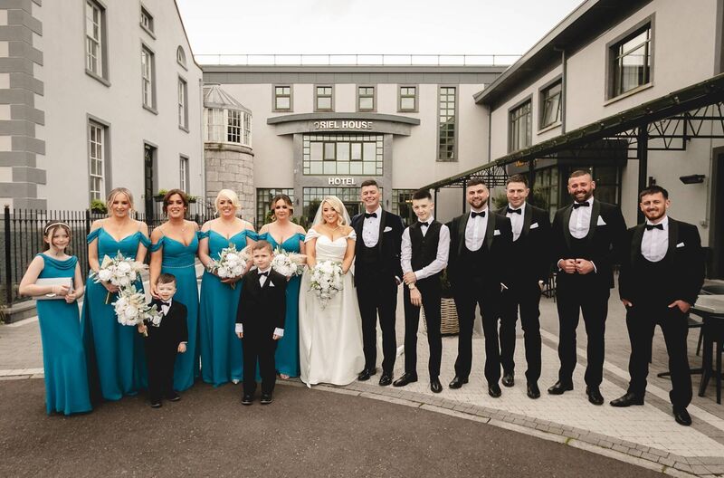 The couple with their wedding party, five bridesmaids and five groomsmen, who were made up of family and friends.