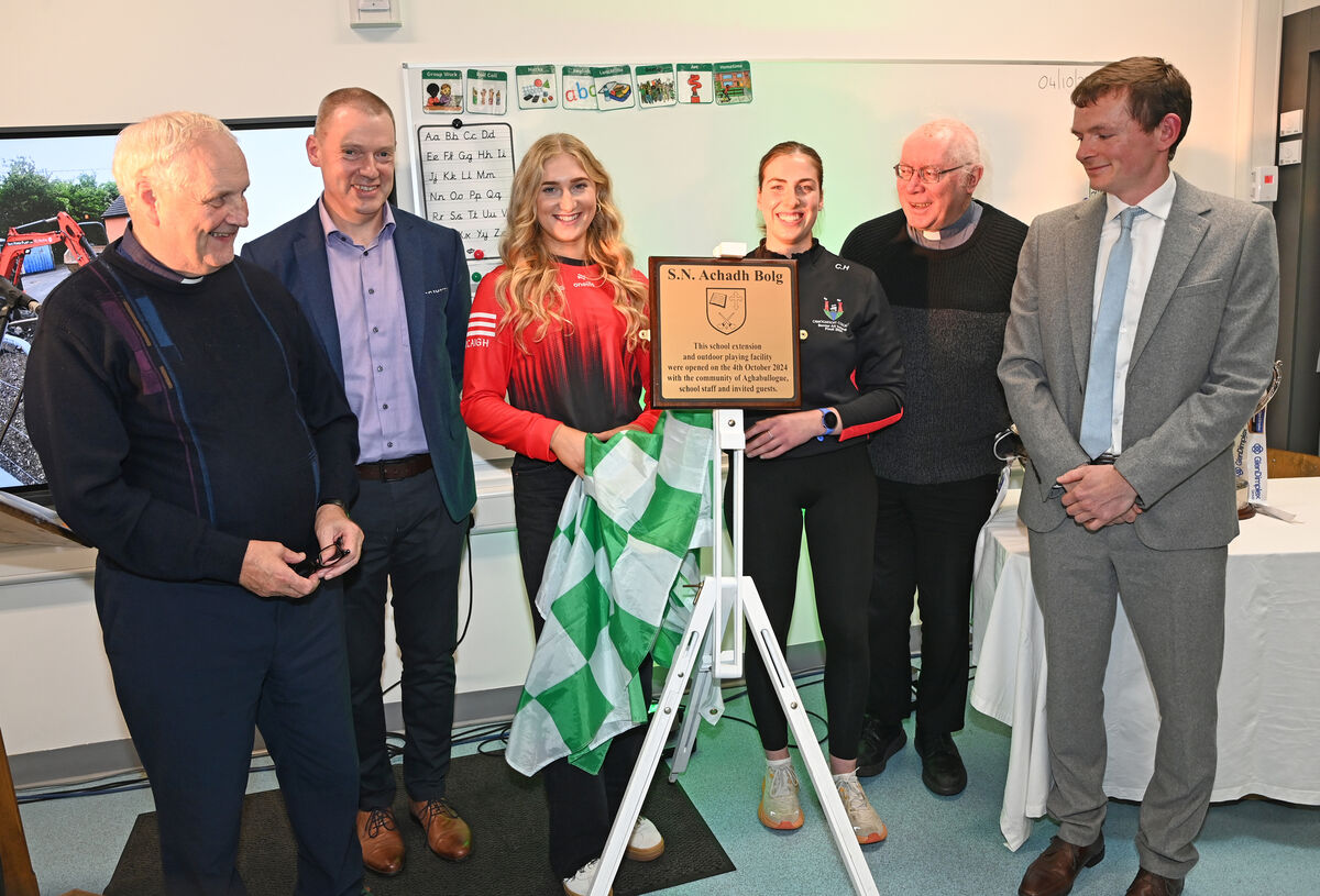 Former pupils and camogie stars Meadhbh Ring and Cliona Healy unveil a plaque with Fr Donal Roberts; Tadhg O’Riordan, board of management; Fr Peadar Murphy; and Michael Mather, principal, during the blessing and opening of the new classroom and playing facilities at Aghabullogue NS. Picture: Eddie O'Hare. Former pupils and camogie stars Meadhbh Ring and Cliona Healy unveil a plaque with Fr Donal Roberts; Tadhg O’Riordan, board of management; Fr Peadar Murphy; and Michael Mather, principal, during the blessing and opening of the new classroom and playing facilities at Aghabullogue NS. Picture: Eddie O'Hare.