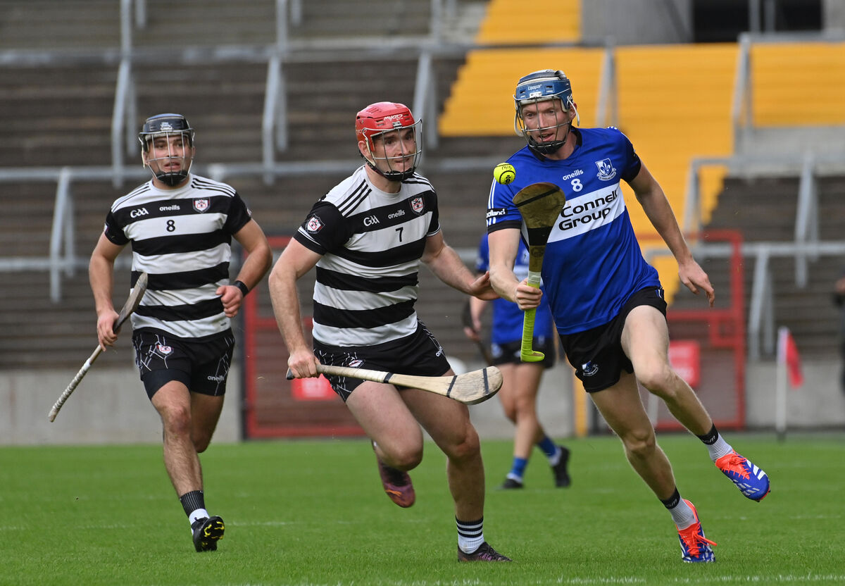 Sarsfields' Cian Darcy tries to get away Midleton duo Mikey Finn and Eoin Moloney. Picture: Dan Linehan