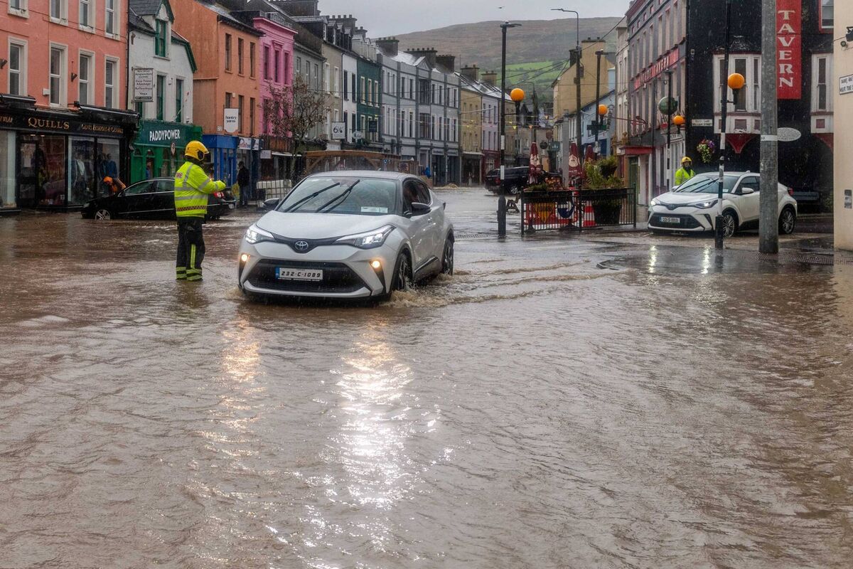Council workers and the fire service were out in force trying to stem the flood waters in Bantry on Saturday. Picture: Andy GIbson.