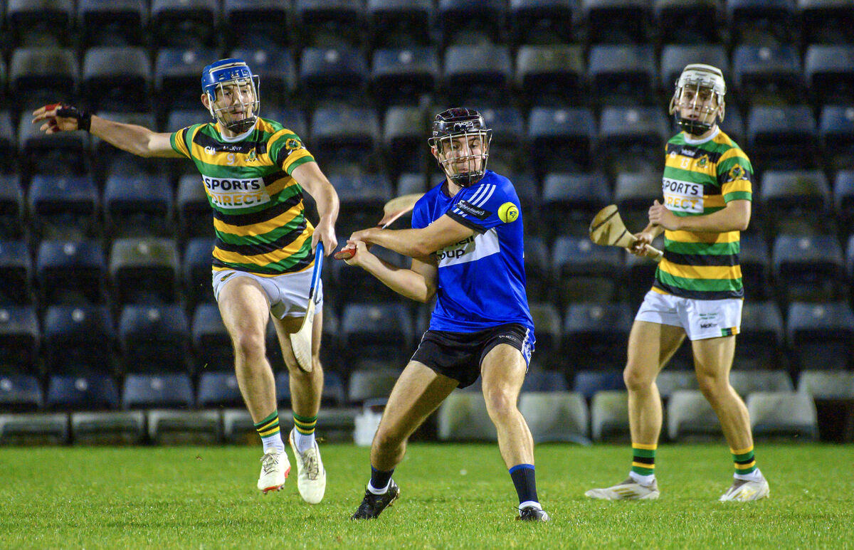  Darragh O'Donovan of Sarsfields gets a shot away despite pressure from Glen Rovers' Jake Brosnan. Picture: Dan Linehan