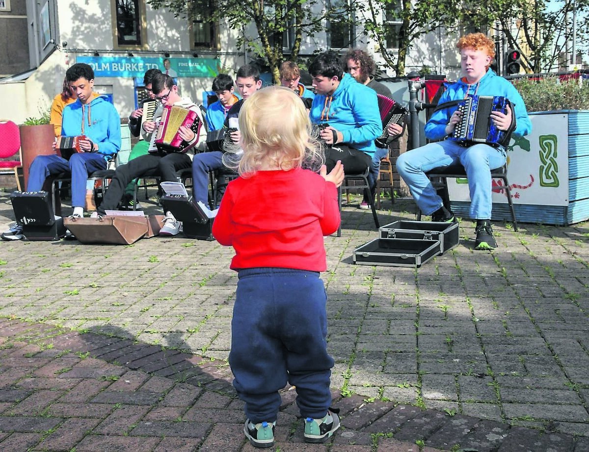 Isaac Cummings listens to the music by Club Ceoil Knocknaheeny at the Free Family Fun Day that took place at the Plaza, Blackpool.	