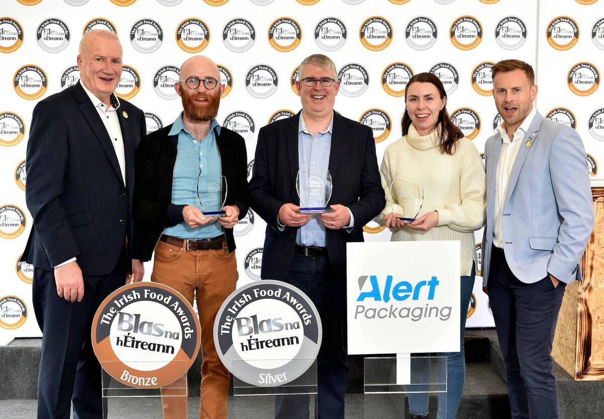 Micheal O Lionaird, Pat O’Farrell, Orla Robertson Company of Follain pictured receiving their awar  from John Sheehy, Blas na  