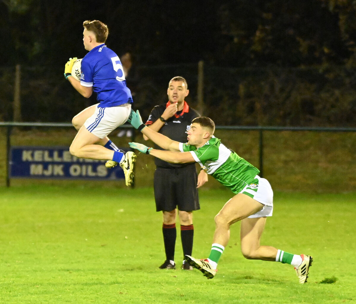 Naomh Abán's Dara Mickey Ó Loingsigh wins the ball from Aghabullogue's Padraig O'Sullivan. Picture: Eddie O'Hare Naomh Abán's Dara Mickey Ó Loingsigh wins the ball from Aghabullogue's Padraig O'Sullivan. Picture: Eddie O'Hare