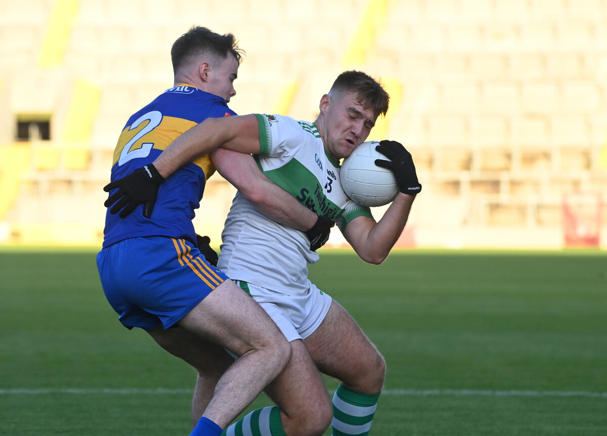Kanturk's Grantas Bucinskas under pressure from Carrigaline's Chris O'Herlihy. Picture: Larry Cummins