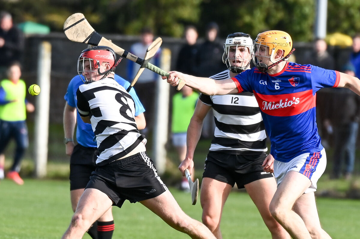 Midleton's Rory Hartnett shoots as Ian O'Mahony of Erin's Own closes in, during their IAHC clash at Cobh. Picture: David Keane. Midleton's Rory Hartnett shoots as Ian O'Mahony of Erin's Own closes in, during their IAHC clash at Cobh. Picture: David Keane.
