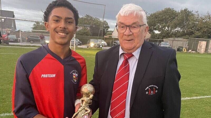 Lakewood Athletic attacker Karim Fonseca gets the Gary McCarthy Trophies Man of the Match award from Christy Byrne, Cork Youth League, at Castletreasure.