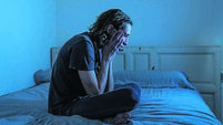 Devastated millennial man crying sad feeling hurt and hopeless suffering Depression. Depressed teenager victim of bullying or ab
