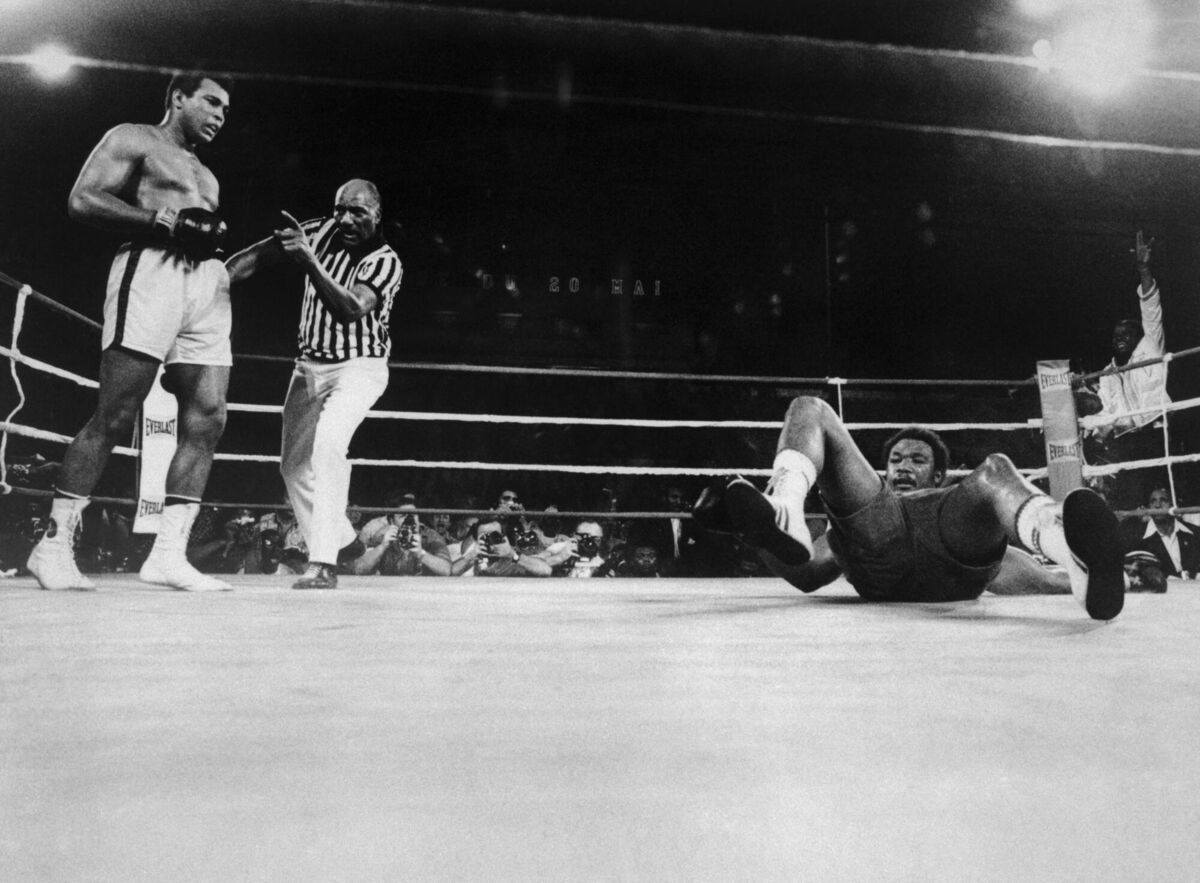 Muhammad Ali (left) knocks George Foreman onto his back during the eighth round of their world heavyweight title boxing match in Zaire - their famous Rumble in the Jungle - which took place 50 years ago this month, on October 29, 1974