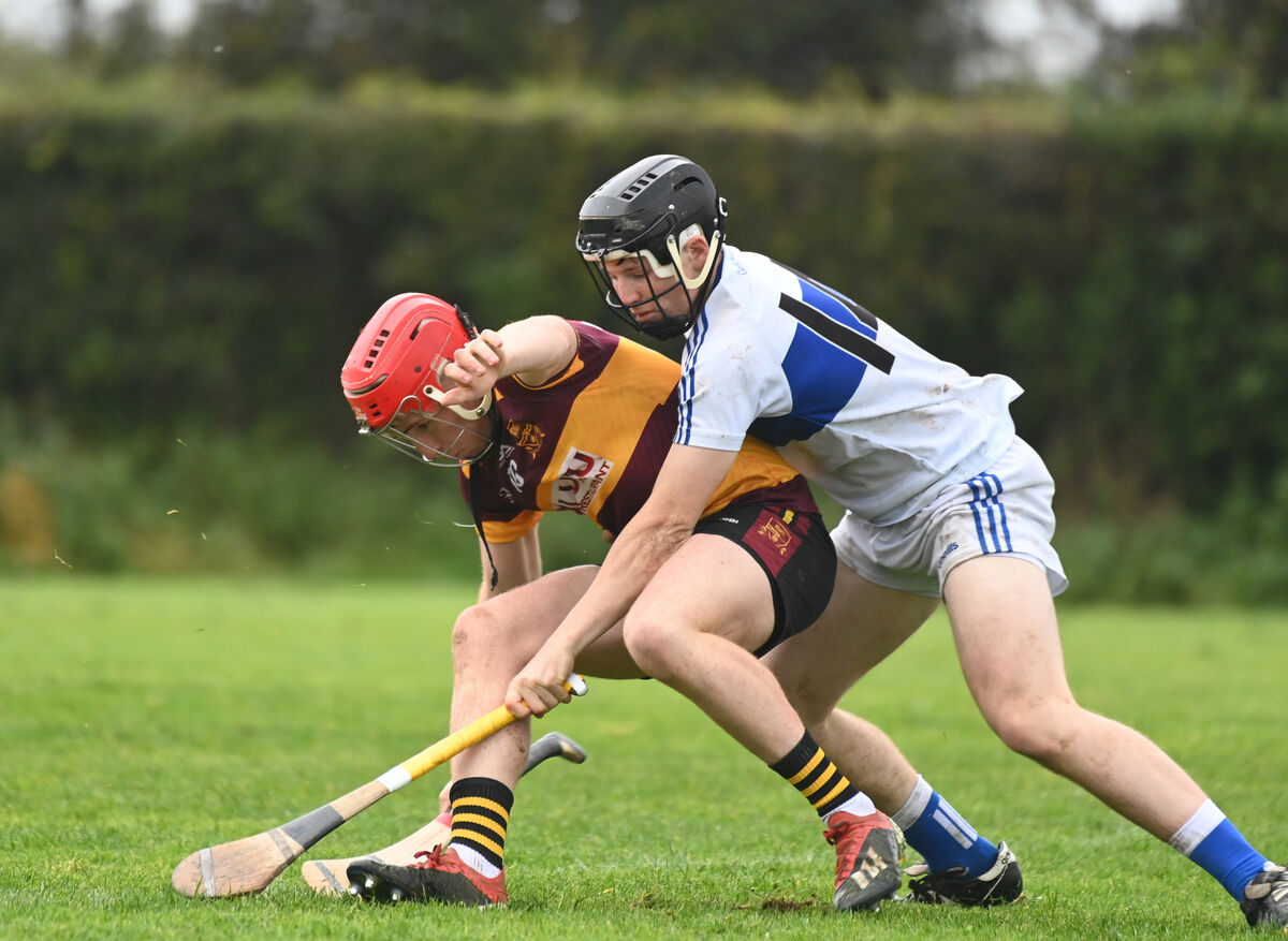  Colm Hartley of De La Salle tries to keep possession under pressure from Gaelcholáiste Mhuire's Darragh Ó Conaill. Picture: Larry Cummins