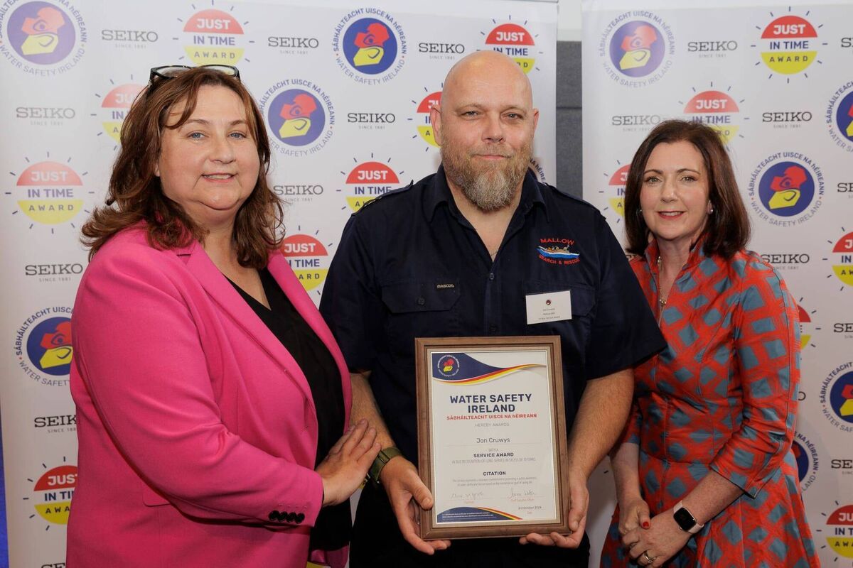 Jon Cruwys, of Mallow Search and Rescue, receives his award from Minister Anne Rabbitte and Clare McGrath, Chairperson, Water Safety Ireland Jon Cruwys, of Mallow Search and Rescue, receives his award from Minister Anne Rabbitte and Clare McGrath, Chairperson, Water Safety Ireland