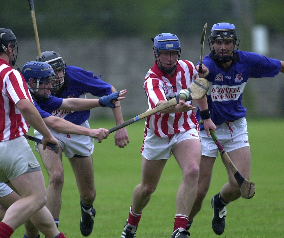 Imokilly's Ger Melvin is tackled by Sarsfields' Kieran Murphy, Ronan Murphy and Garvan McCarthy. Picture: Eddie O'Hare