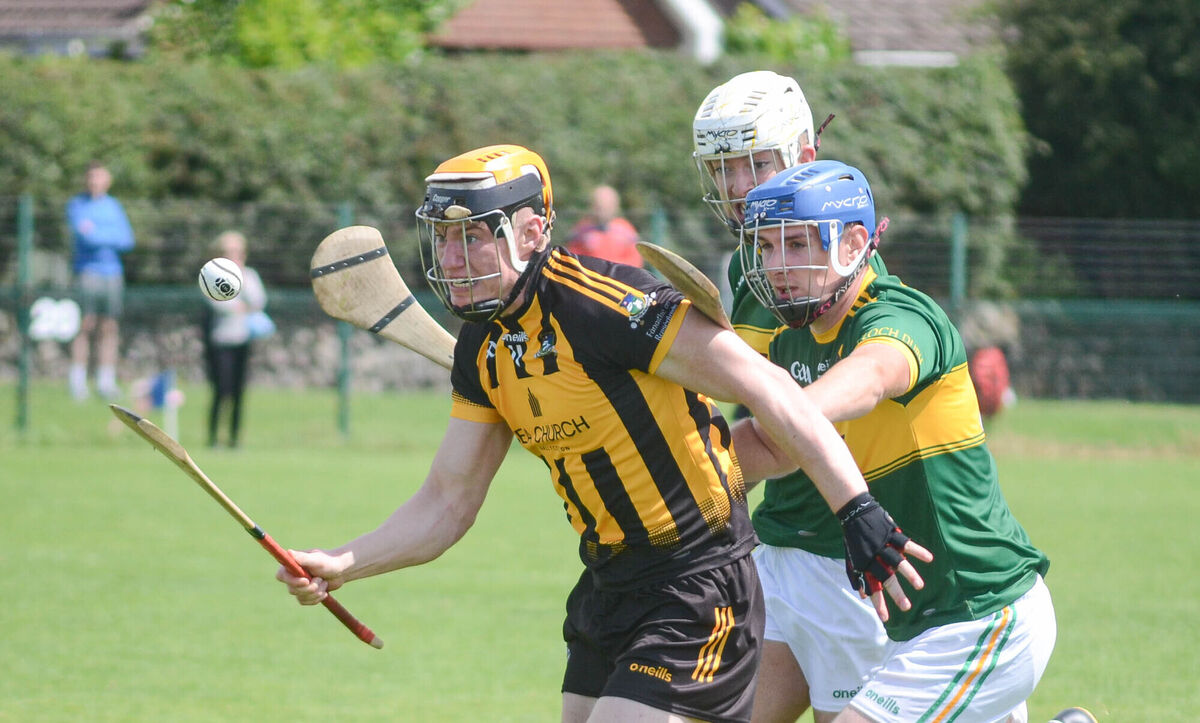 EE 09/07/2023 SPORT - Russell Rovers Kevin Moynihan controls the sliothar ahead of Cloughduv's Kevin Tattan and Paul Lane during the Red FM Div 5 Hurling league final in Caherlag. Picture: Howard Crowdy  EE 09/07/2023 SPORT - Russell Rovers Kevin Moynihan controls the sliothar ahead of Cloughduv's Kevin Tattan and Paul Lane during the Red FM Div 5 Hurling league final in Caherlag. Picture: Howard Crowdy