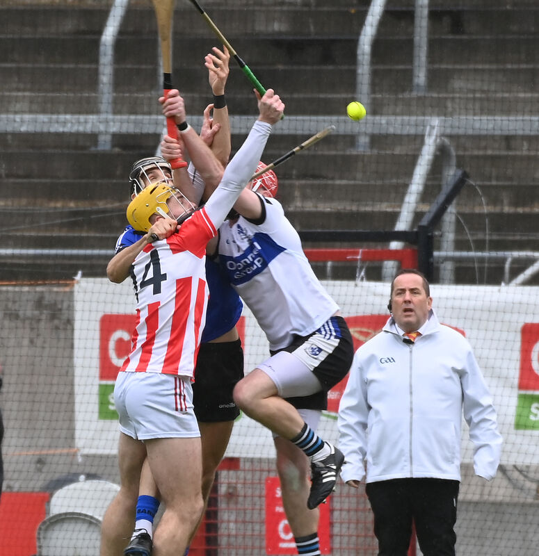 Sarsfields' Donnacha McCarthy and Craig Leahy combine to stop Imokilly's Sean Desmond. Picture: Eddie O'Hare Sarsfields' Donnacha McCarthy and Craig Leahy combine to stop Imokilly's Sean Desmond. Picture: Eddie O'Hare